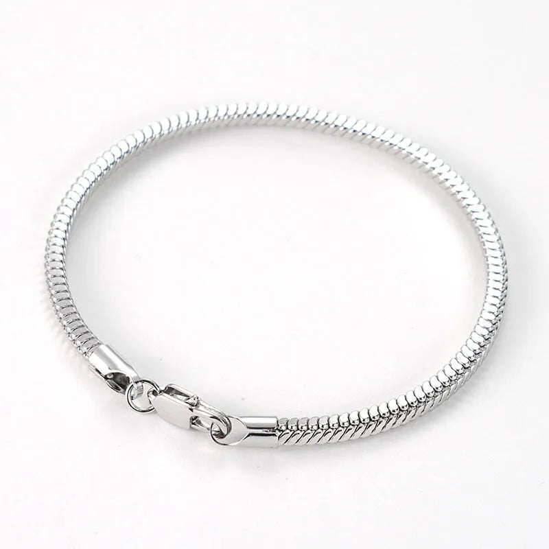 Stainless steel snake chain bracelet in silver tone, geometric line design with electroplated finish