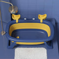 Blue foldable plastic pet tub for washing a small dog or cat.