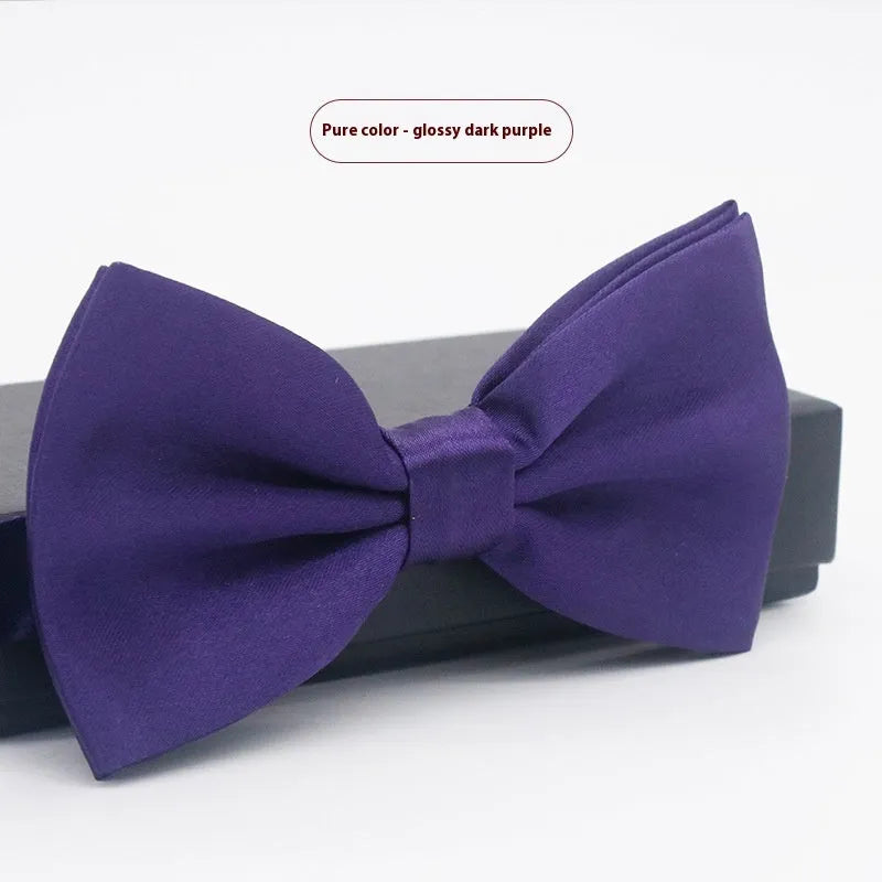 Men's flat head style polyester bow tie in a solid colour, shown with adjustable neck strap.