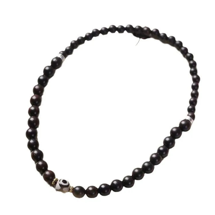 Ebony bracelet with Tibet beads design showing two-tone colour circles and 8mm diameter
