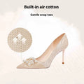 Champagne gold women's leather high heel pumps with pointed toe, stiletto heel, and rhinestone decoration.