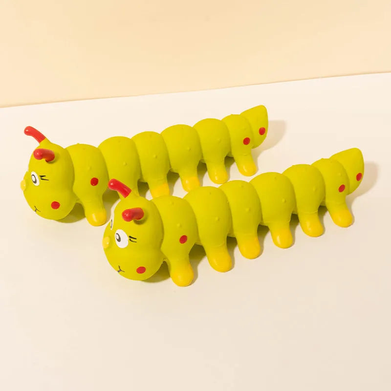 Yellow rubber caterpillar squeaky chew toy for small dogs, 25.5 cm long.