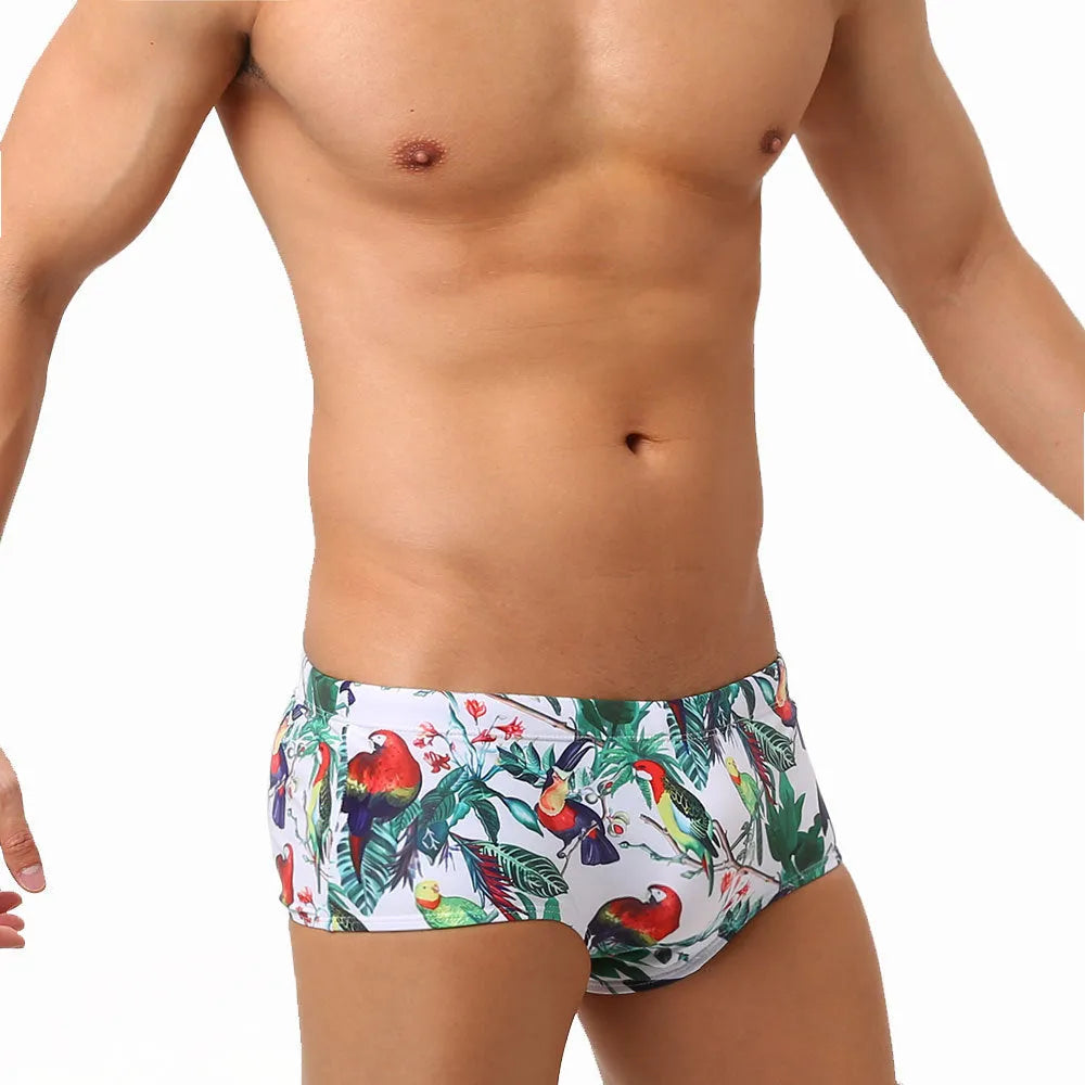 Men's navy swim trunks with white and red flower-bird print pattern, boxer briefs style
