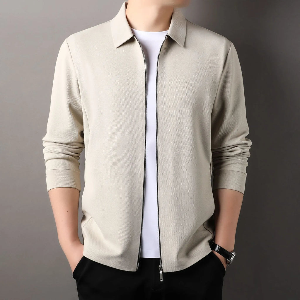 Men's casual business jacket in black, dark grey, or apricot with long sleeves and a straight hem.