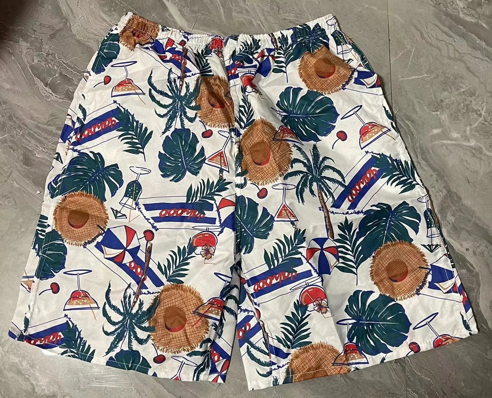 Men's floral print swimming trunks in polyester with five-point design