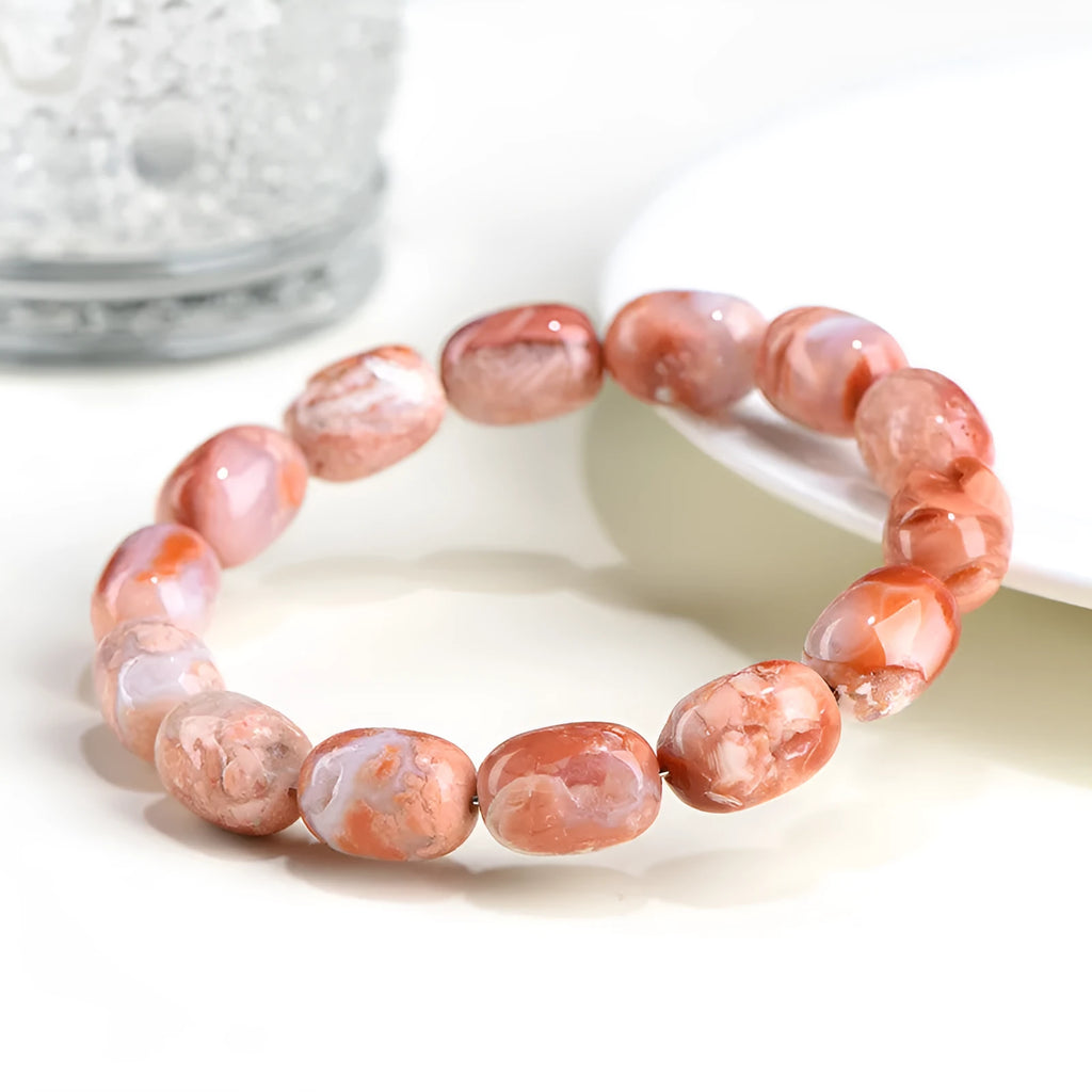 Natural cherry agate barrel bead bracelet with 10x14mm geometry and Ruyi design elements