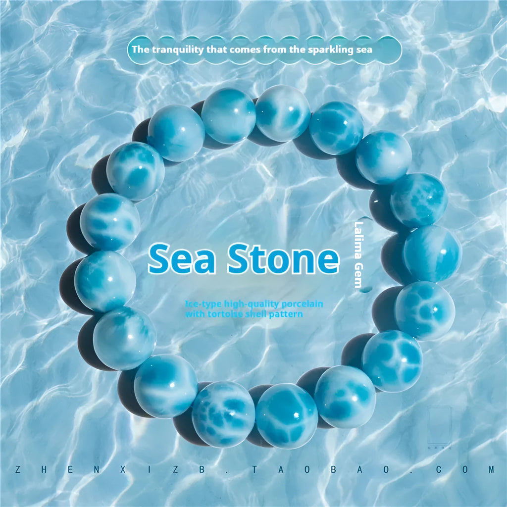 Blue and natural toned handmade bodhi bracelet with sea-pattern stones and pearl elements