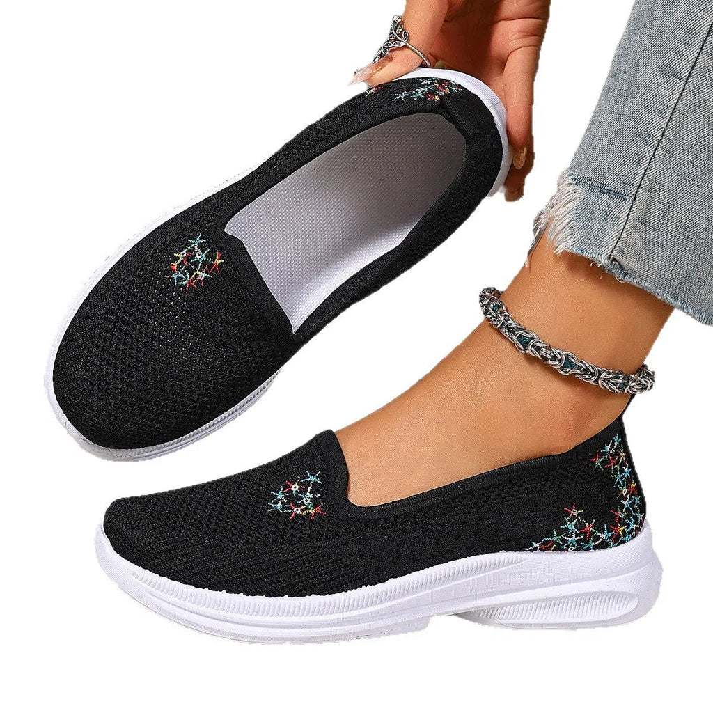 Women's mesh casual slip-on shoes in beige with round toe and low-cut shaft on a plain background