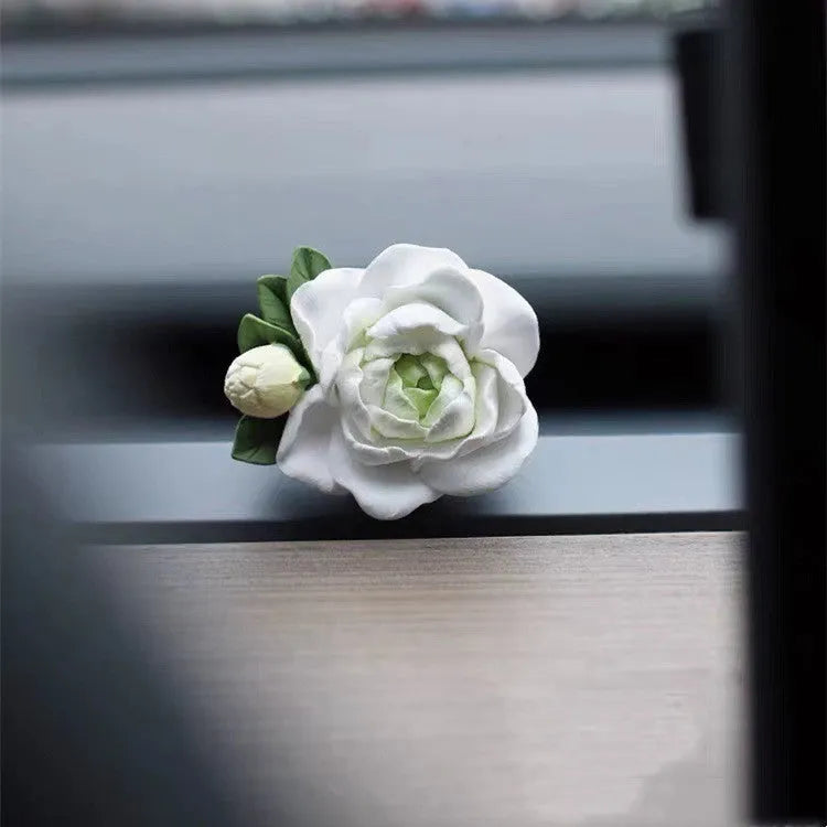 Solid jasmine car perfume for air vent with gypsum base and essential oil bottle in beige white or green.