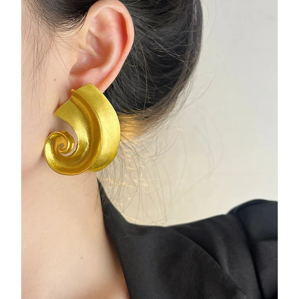 Geometric retro design ear studs in gold and silver colours measuring 5cm