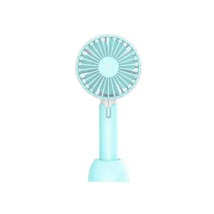 Blue mini handheld USB electric fan with three-speed control on a desk.