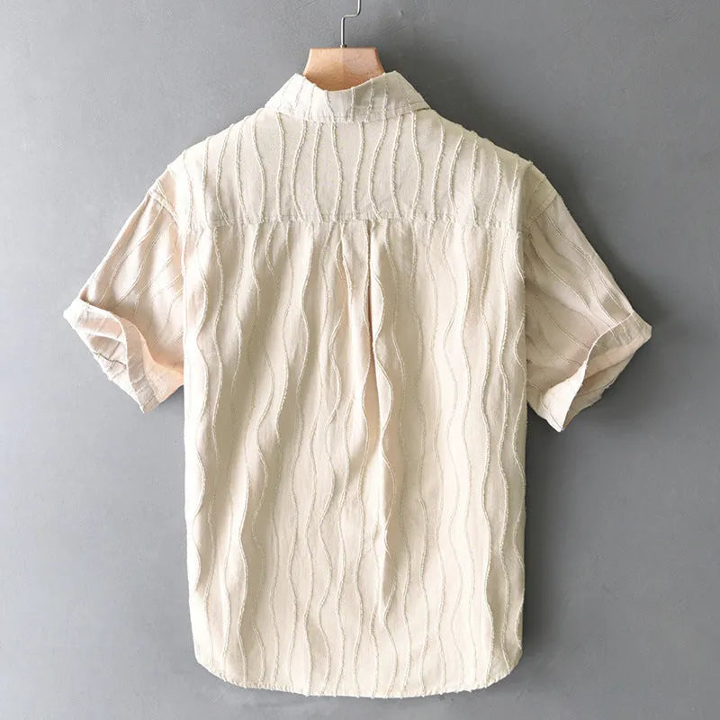 Men's loose-fitting pure cotton casual shirt in apricot colour with short sleeves.
