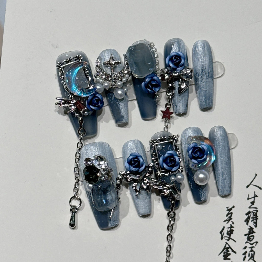 Heavy industry blue evening manicure nails with twinkling rose and flower patterns in four sizes
