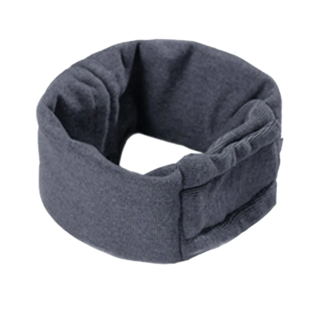 Dog wearing black calming hoodie head cover with ear wrap for noise reduction