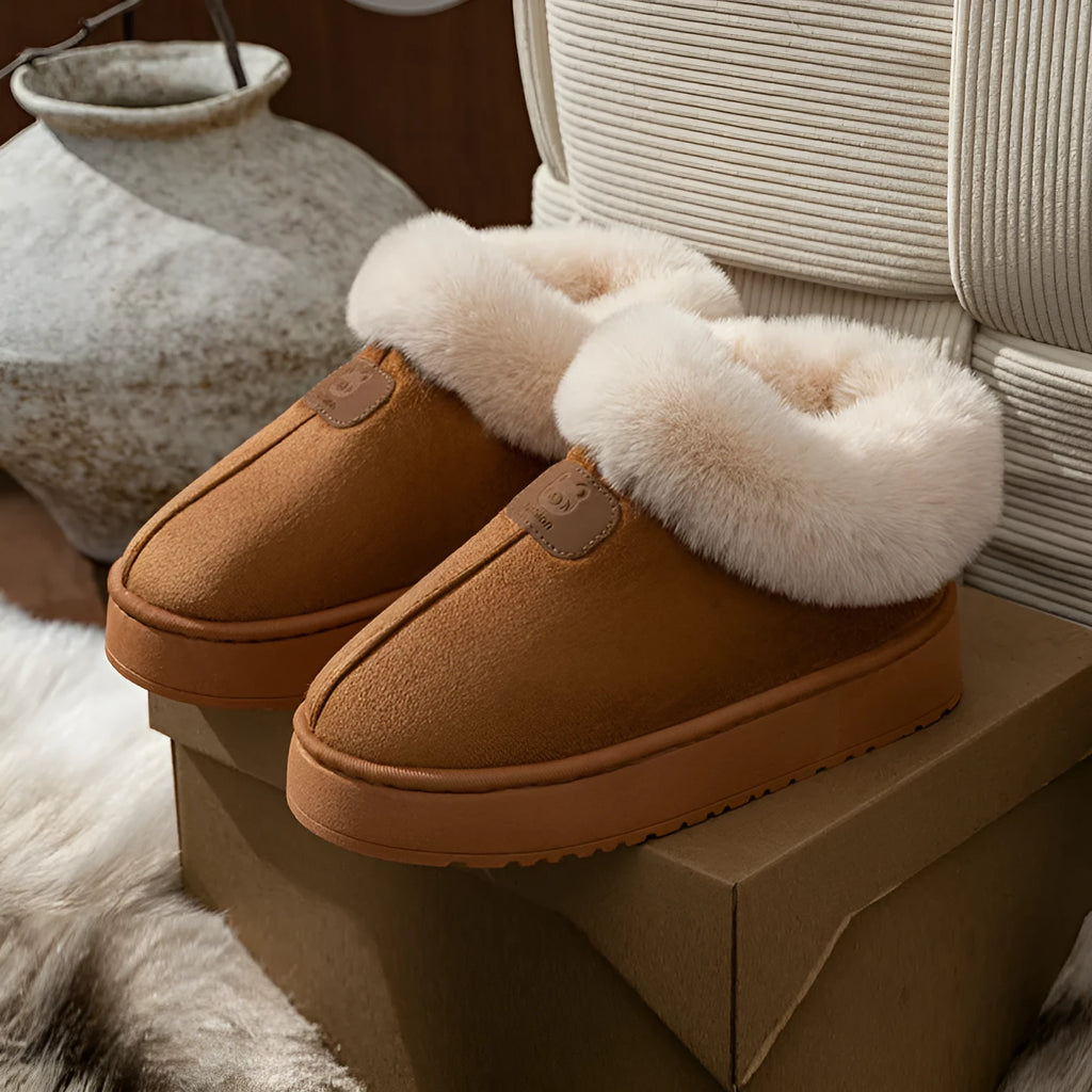 Women's casual solid colour slippers with suede upper and bear logo heel cover on a neutral background