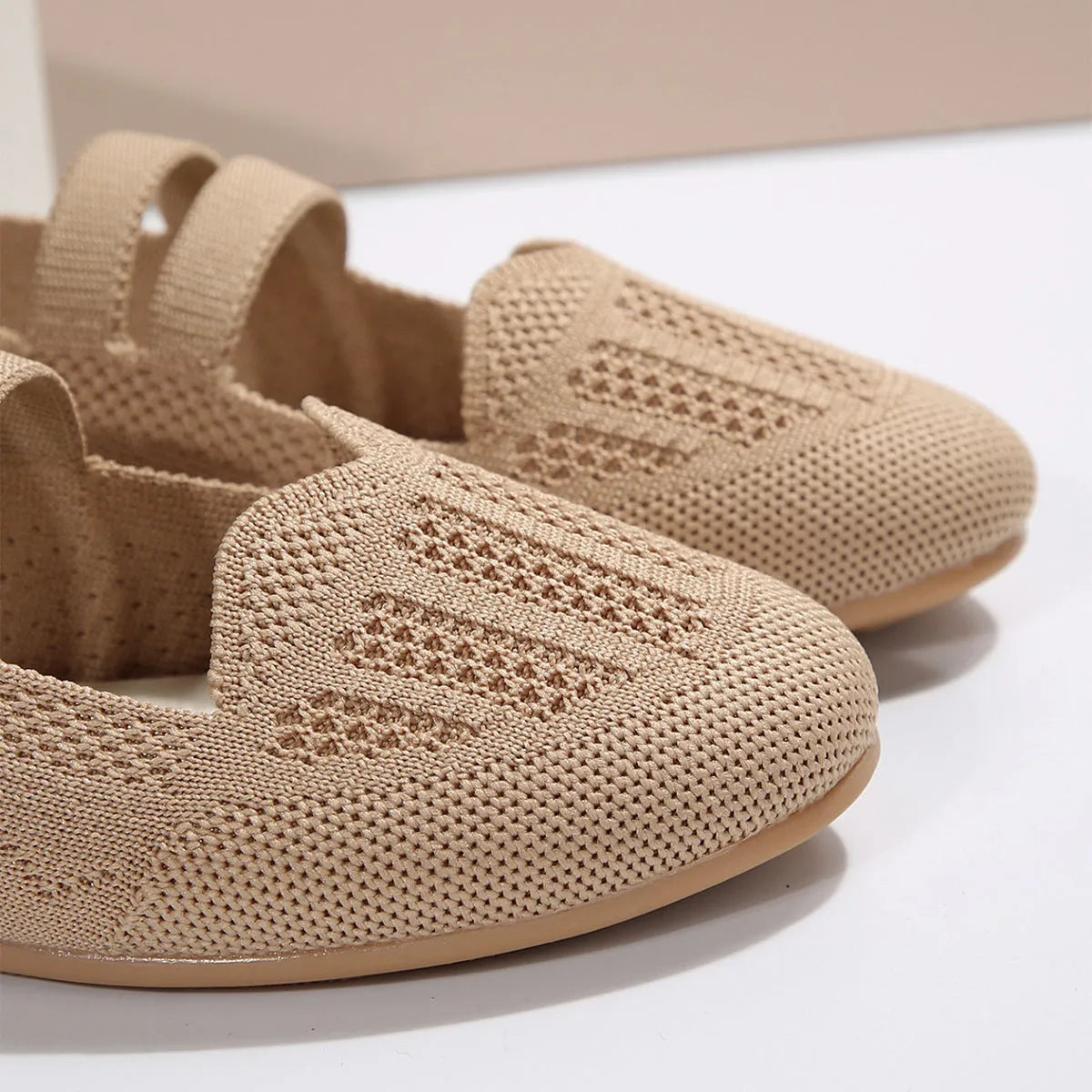 Women's casual mesh slip-on flats in black with round toe, flat heel, and breathable upper