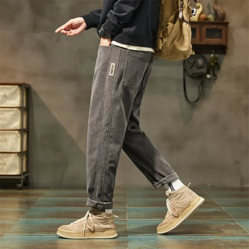 Corduroy men's casual straight-leg trousers in solid colour with mid-waist rise and zipper fly