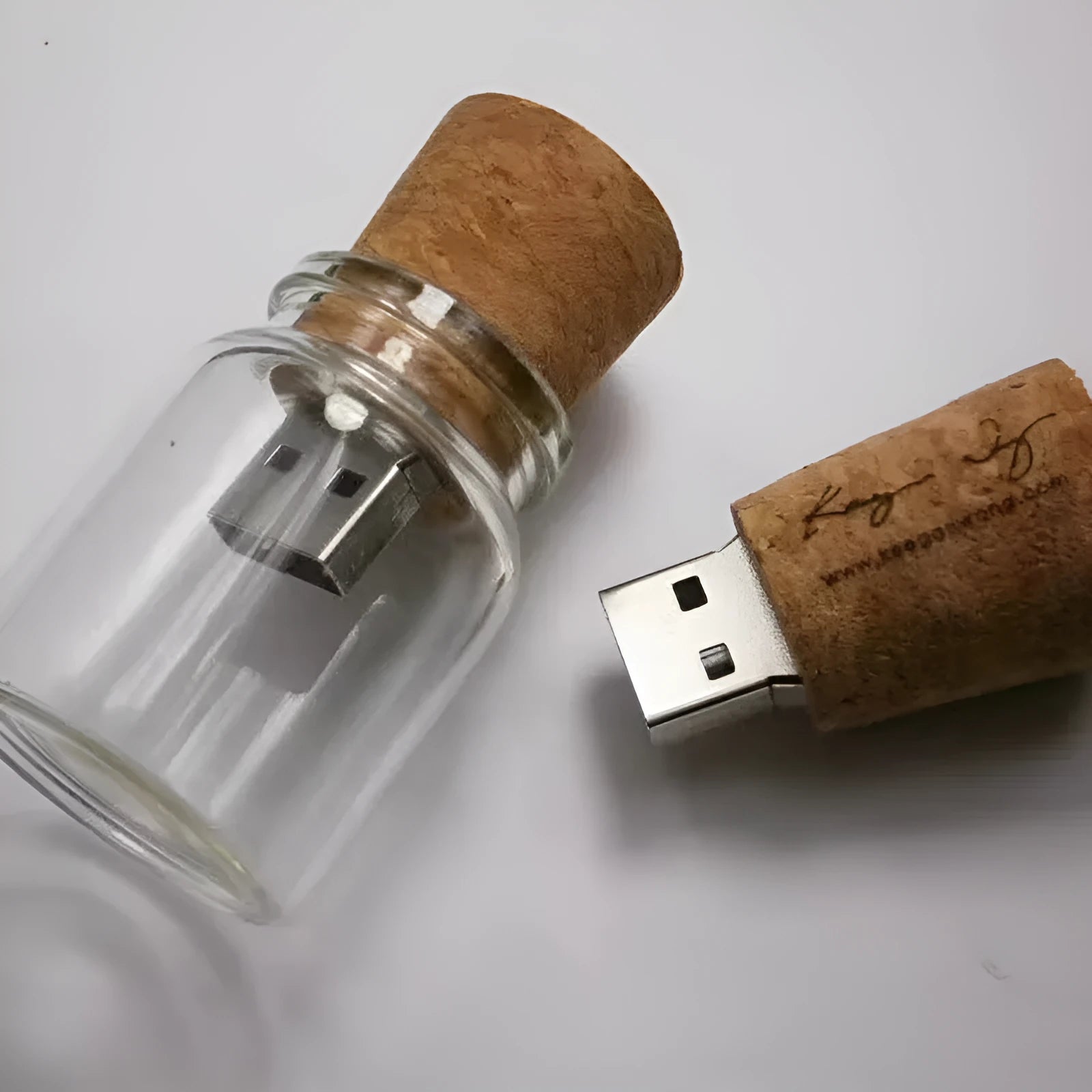 Transparent bottle-shaped USB flash drive with bamboo wood stopper showing drift bottle design