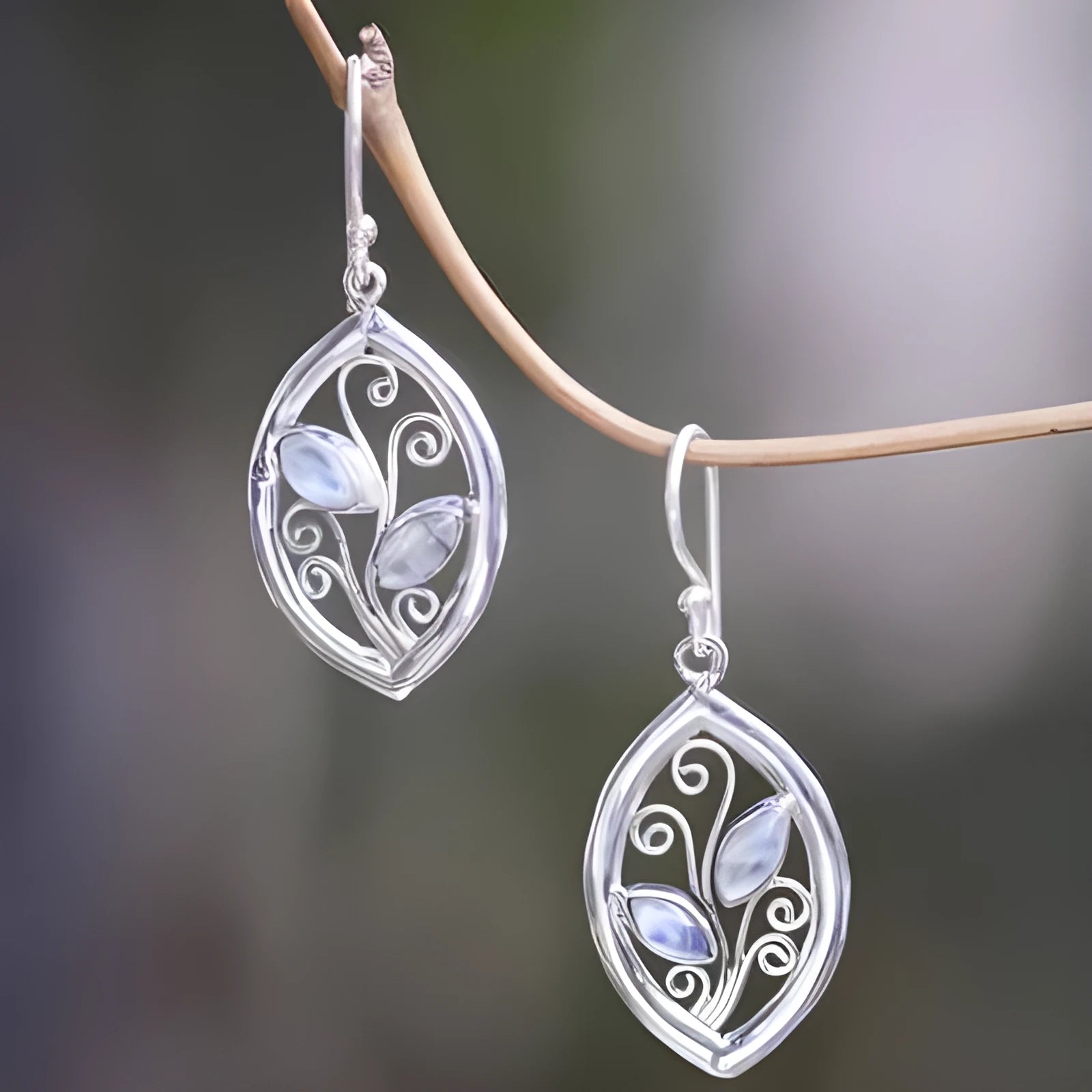 Silver-toned leaf-shaped earrings with embedded colourful moonstones for women