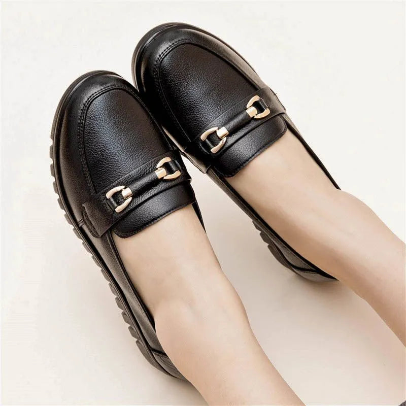 Black women's pumps with soft leather upper, low heel, and round toe casual shoes