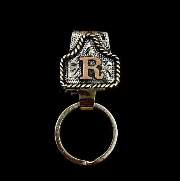 Handmade stainless steel cow tag belt key holder with engraved number plate on a split ring.