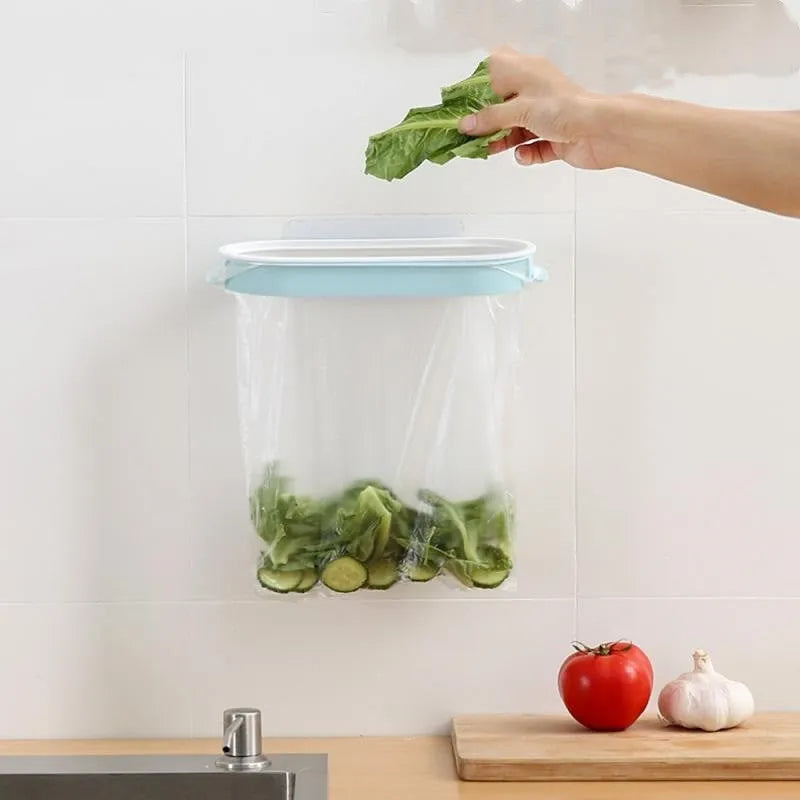 Blue plastic kitchen garbage bag storage rack mounted inside a cabinet.
