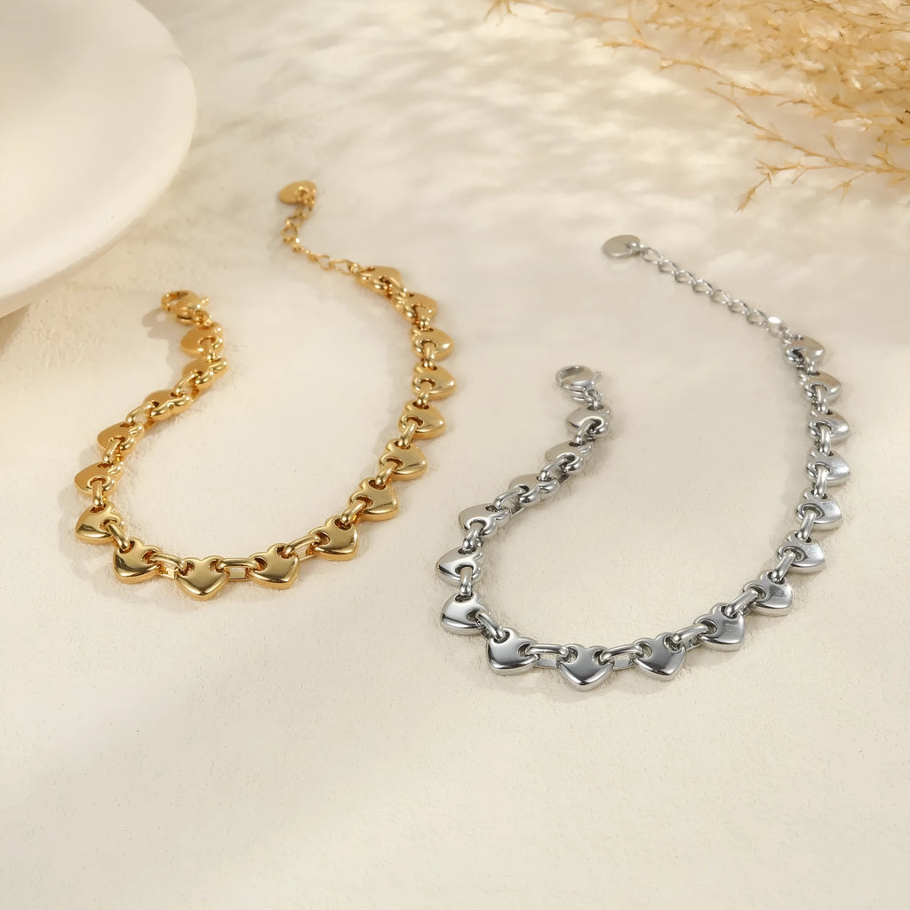 Women's hollowed-out heart bracelet in stainless steel with geometric design and gold plating