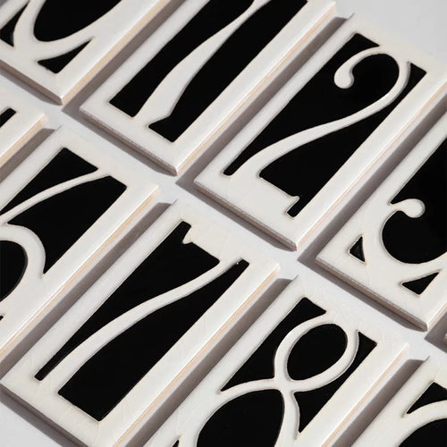 Handmade retro-style ceramic doorplate with a white enamel background and a raised black number 5, shown at 76mm by 152mm.
