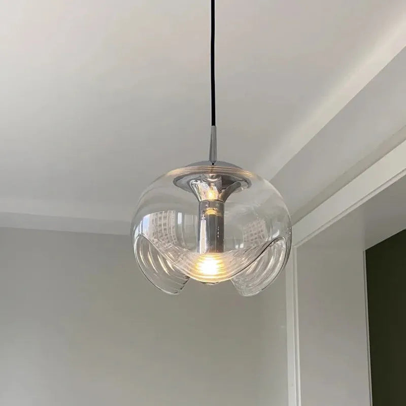 Modern minimalist glass pendant chandelier with a 25cm diameter, shown in transparent, amber, and smoky grey colour options.