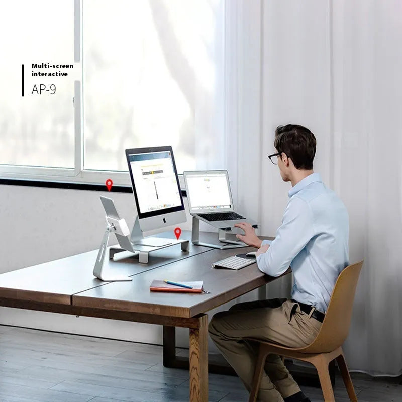 Aluminium alloy laptop stand in black or silver measuring 29.9 x 25.8 x 18.5 cm on a desk