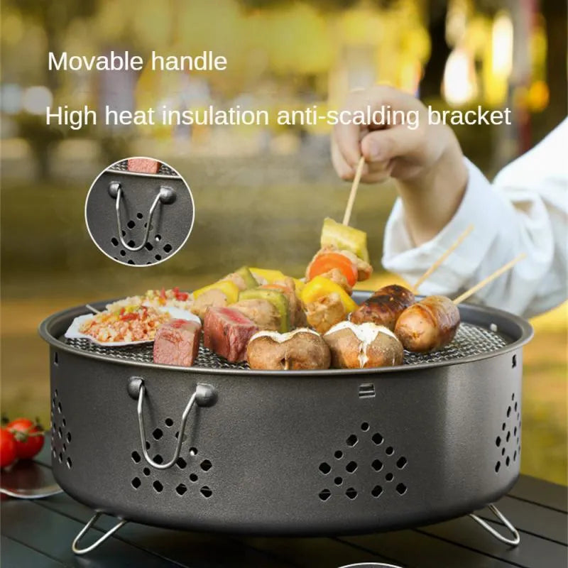 Portable stainless steel BBQ grill with detachable parts and storage bag, shown in grey colour.