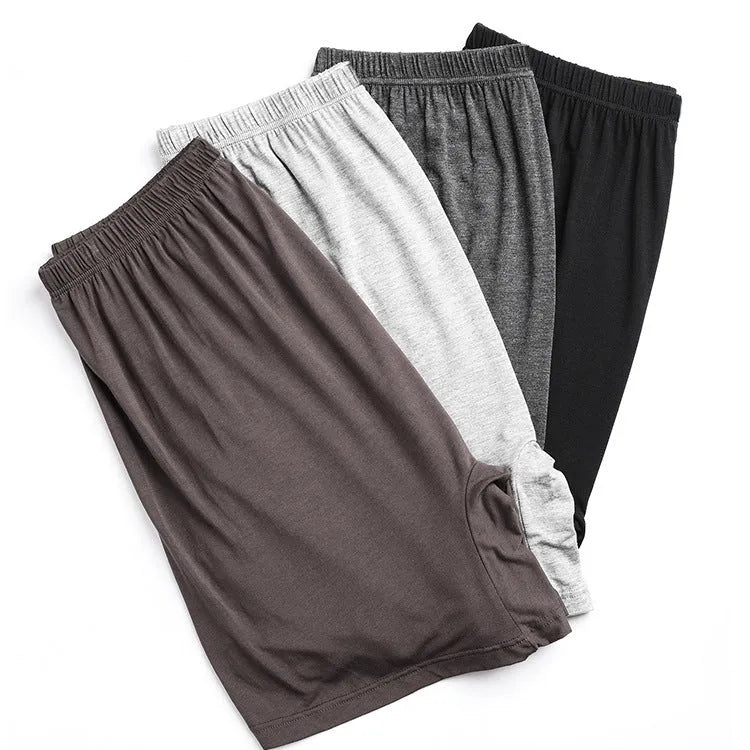 Men's solid colour modal boxer shorts with high waist in black, displayed flat.