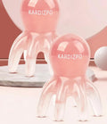 Pink natural resin octopus-shaped massage comb for facial and body meridian therapy.