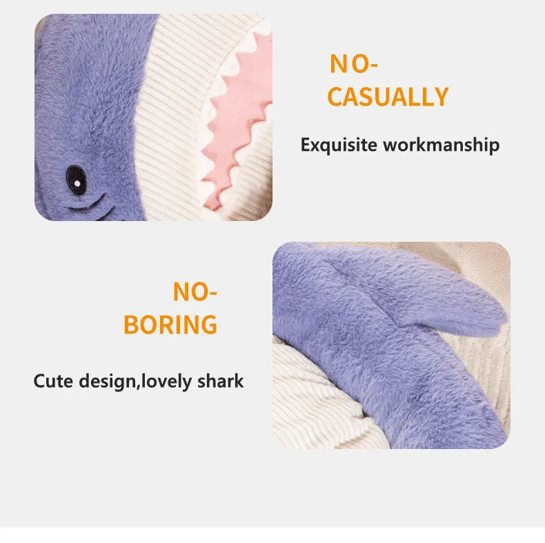 Blue shark pattern pet bed cushion on a floor, showing soft velvet material and non-slip base.