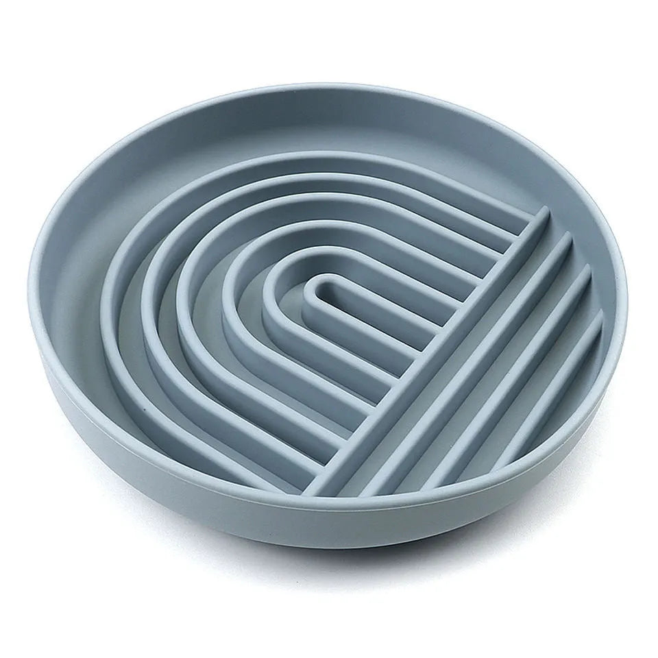 Silicone slow feeder dog bowl with textured ridges and nooks for slow eating, shown in assorted colours.