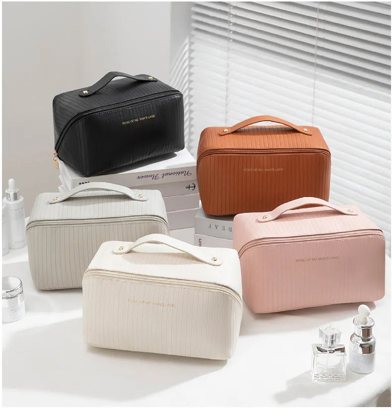 Vertical pattern pillow makeup bag in cubic design measuring 22.5cm height with travel storage capacity