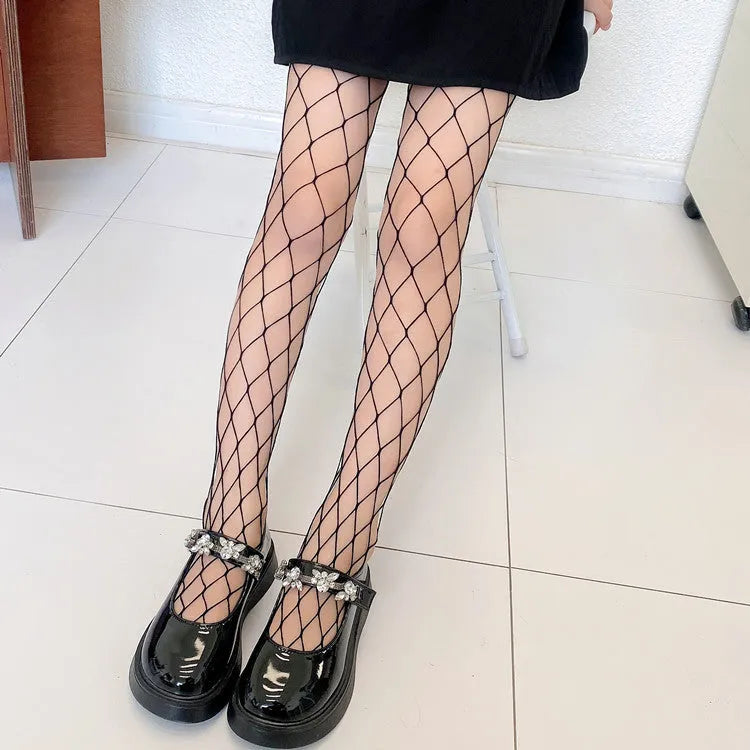 Women's mesh stockings showing large, medium and small patterns in black and white colours