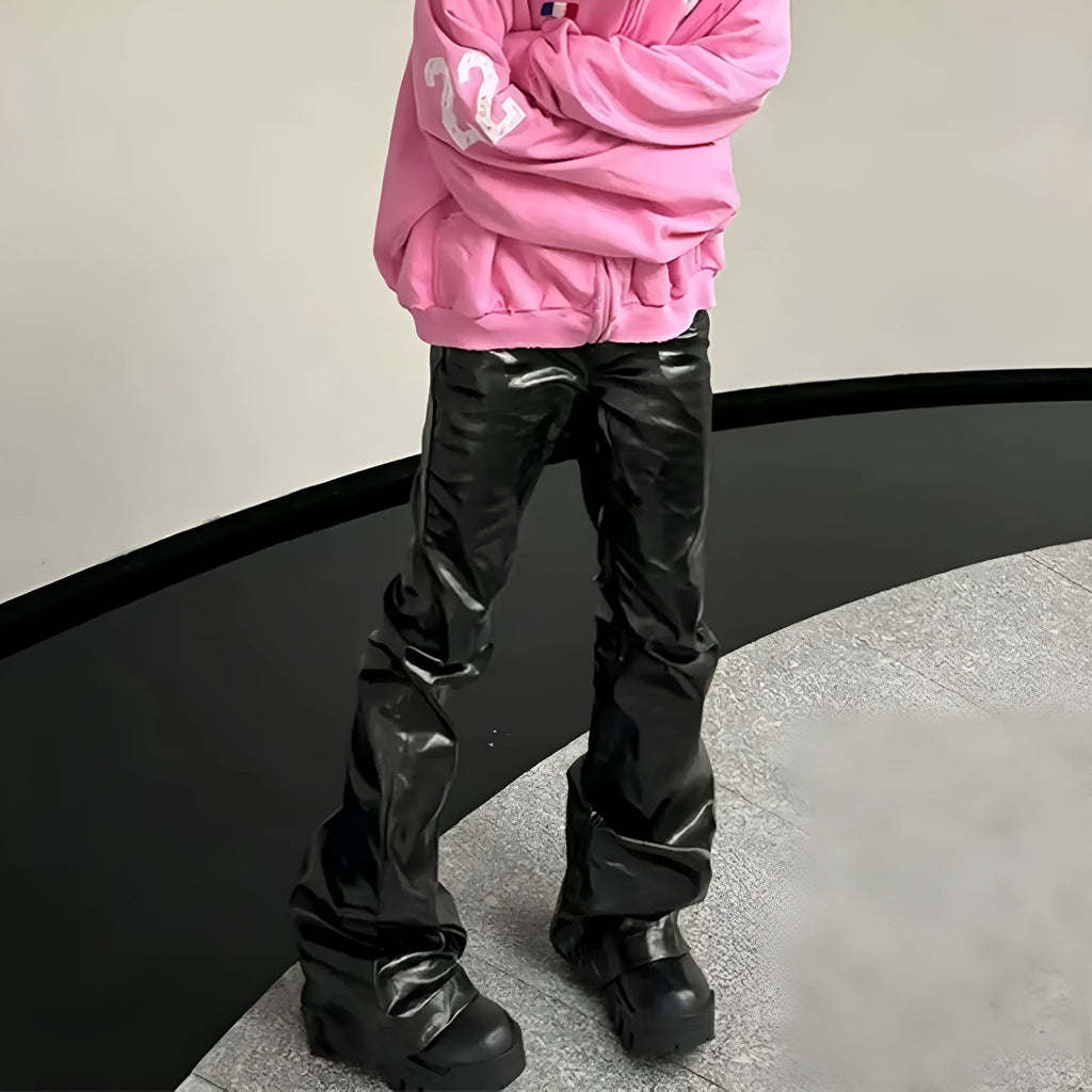 Black coated patent leather skinny jeans with a shiny straight-leg fit on a mid waist.