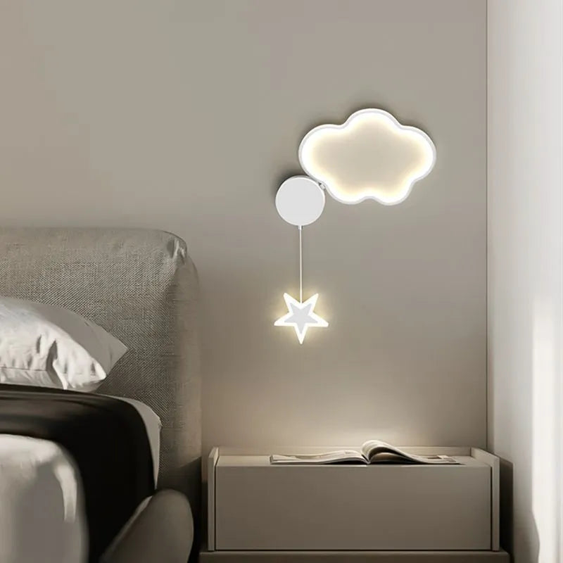 Five-pointed star shaped bedside wall lamp with cloud motif in black finish mounted beside bed
