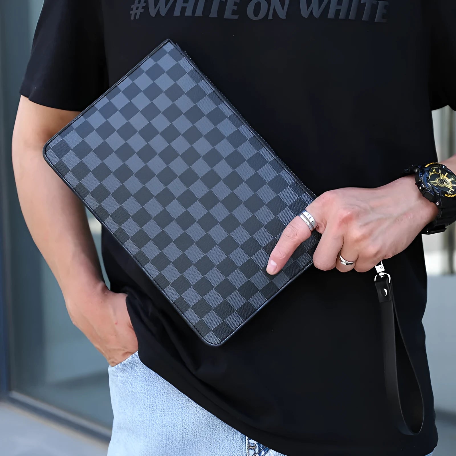 Men's black checkered pattern PU leather clutch showing card slots and handheld design.