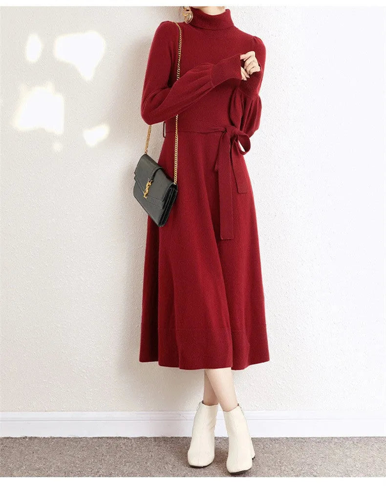 Turtleneck knitwear dress in polyester fabric with elastic waist and loose hem in solid colour