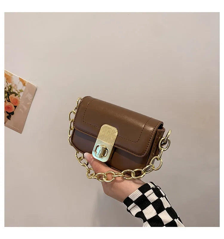 Niche chain shoulder messenger phone bag in horizontal square PU with soft handle and lock detail, brown colour option
