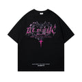 Man wearing a black retro print cotton T-shirt with short sleeves and a round neck.