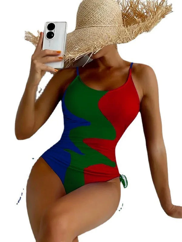 Blue women's sleeveless backless one-piece swimsuit with a striped print, made from polyester and nylon fabric.
