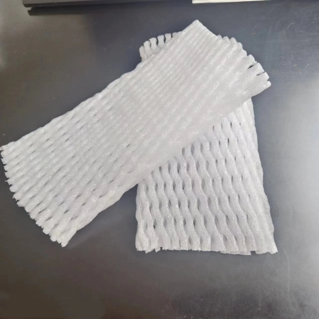 White foam fruit protective net cover showing shockproof design for produce protection