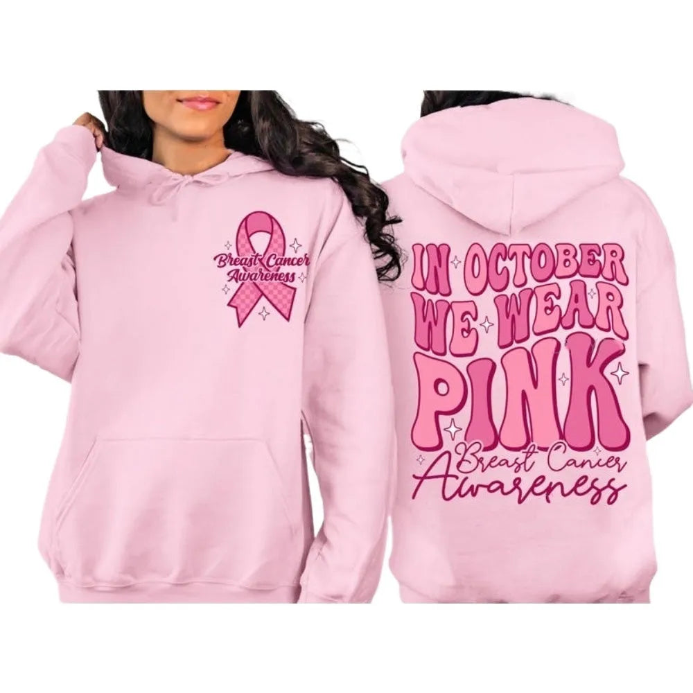 Pink breast cancer awareness pullover hoodie with retro art print and side seam pockets.
