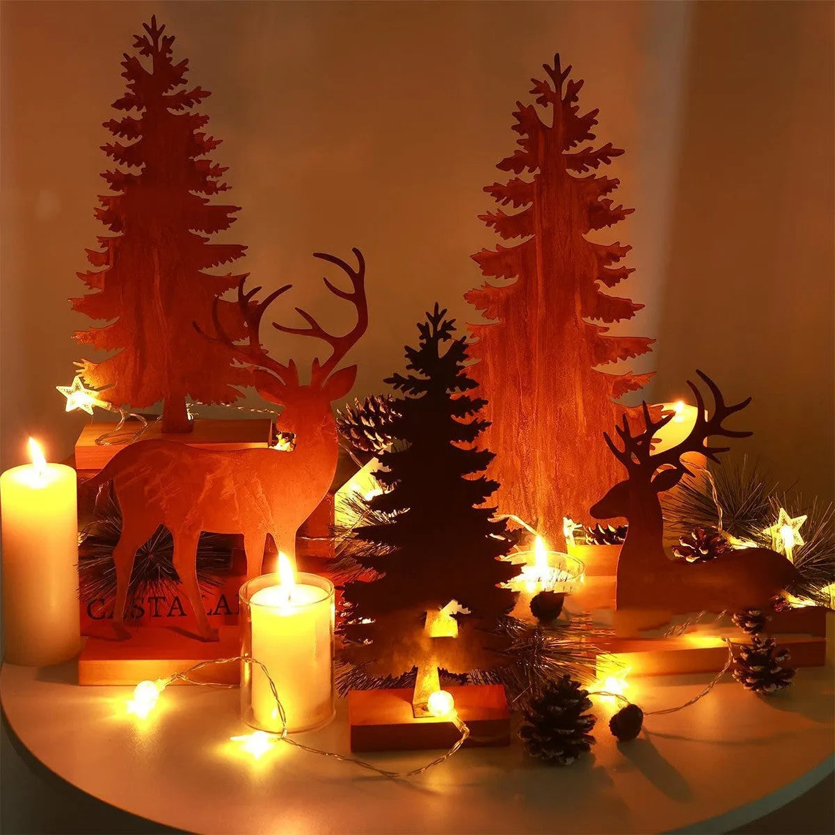 Set of three rusty metal Christmas ornaments featuring elk and tree designs.