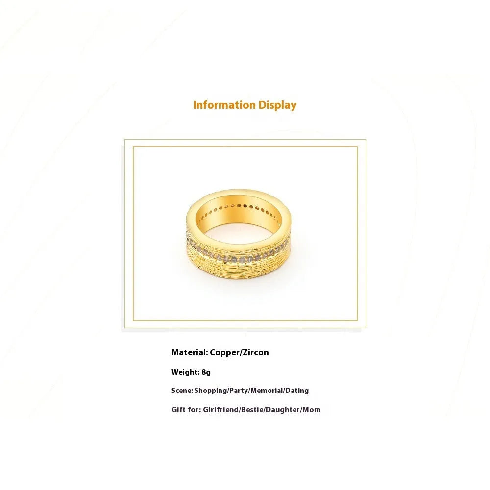 Gold colour geometric women's ring with a zircon stone on a copper band.