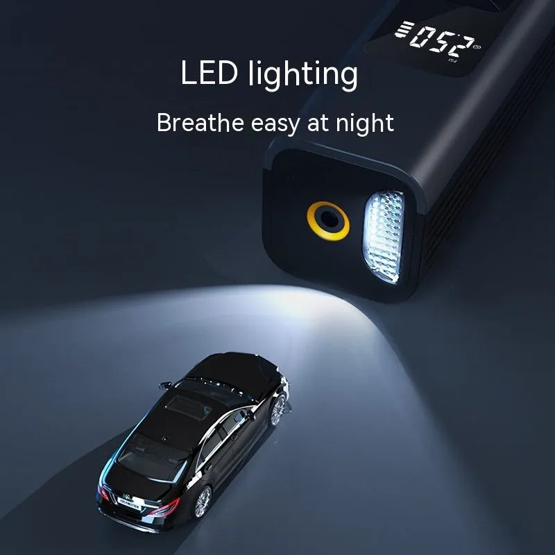 Compact black wireless car tyre inflator and vacuum cleaner with digital screen and LED light
