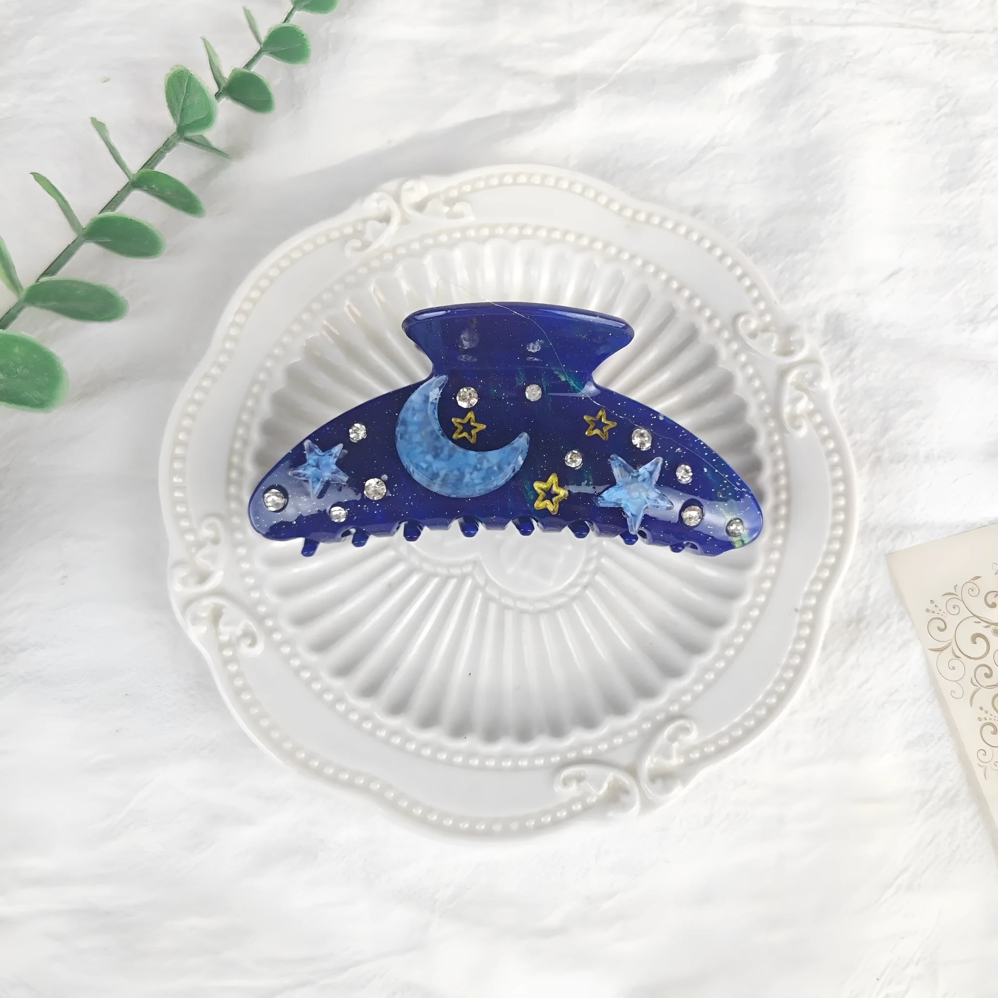 Oversized hair barrette with starry sky pattern in cellulose acetate showing colour options